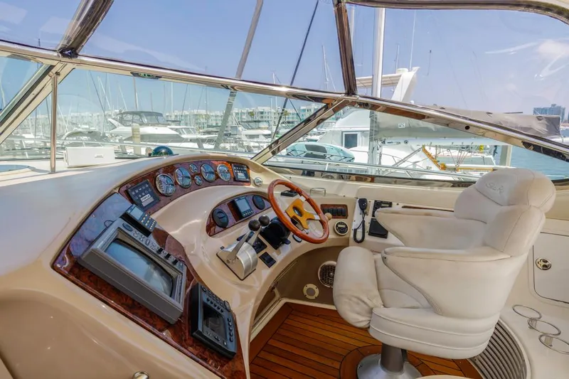 Slide: The Image of Helm of 2000 Sea Ray 510 Sundancer yacht with luxurious controls and seating. - 28