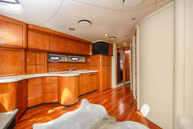 Slide: The Image of Luxurious interior of 2000 Sea Ray 510 Sundancer yacht with wood cabinetry and modern amenities. - 30