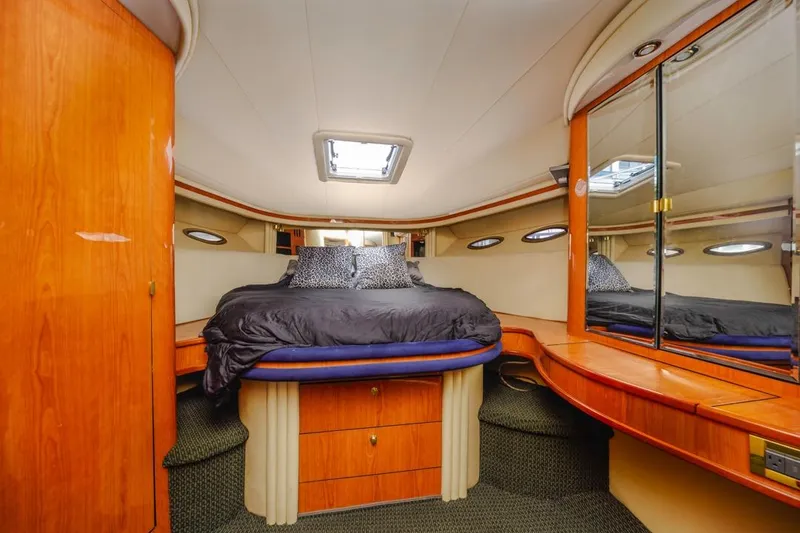 Slide: The Image of Luxurious cabin interior of 2000 Sea Ray 510 Sundancer yacht with elegant wood finish. - 39