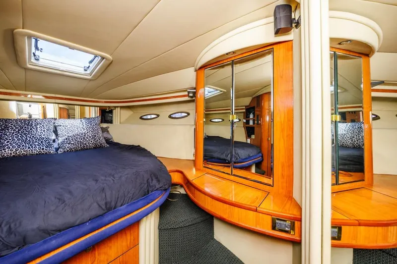 Slide: The Image of Luxurious cabin interior of 2000 Sea Ray 510 Sundancer yacht with mirrored wood accents. - 40