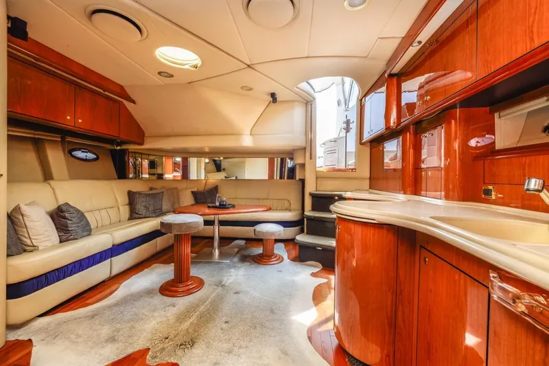 Slide: The Image of Luxurious interior of 2000 Sea Ray 510 Sundancer yacht with elegant wood finishes. - 44