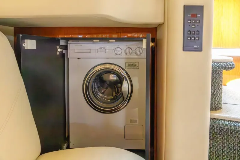 Slide: The Image of Washing machine inside 2000 Sea Ray 510 Sundancer yacht, showcasing luxury amenities. - 47
