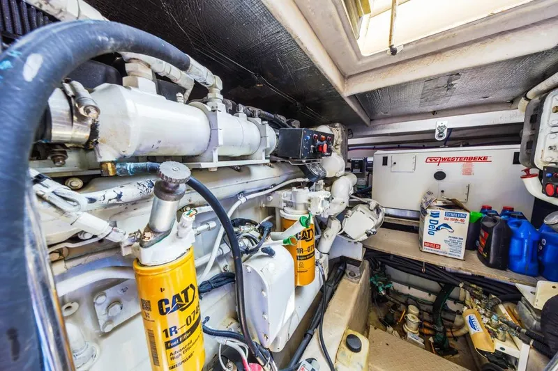 Slide: The Image of Engine room of 2000 Sea Ray 510 Sundancer with CAT filters and Westerbeke generator. - 54