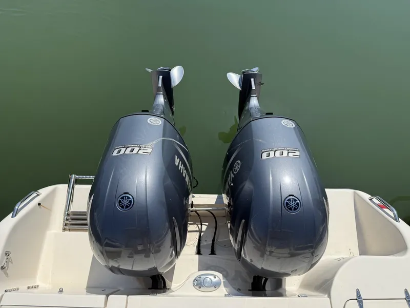Slide: The Image of Twin Yamaha 200 outboard engines on a 2017 Grady-White Freedom 275 boat. - 18