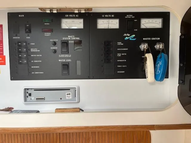 Slide: The Image of Control panel of a 1992 Sea Ray 310 Amberjack boat, featuring electrical and ignition systems. - 14