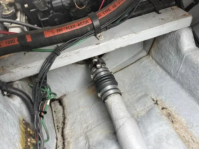 Slide: The Image of Engine compartment of a 1992 Sea Ray 310 Amberjack boat, showing hoses and wiring. - 19