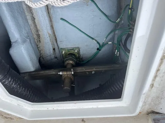 Slide: The Image of Boat engine compartment of a 1992 Sea Ray 310 Amberjack with visible wiring and components. - 21