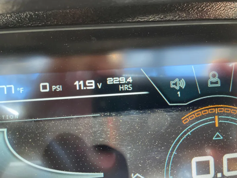 Slide: The Image of Dashboard display of 2021 Nautique Super Air Nautique G25 showing 229.4 hours and 11.9 volts. - 13