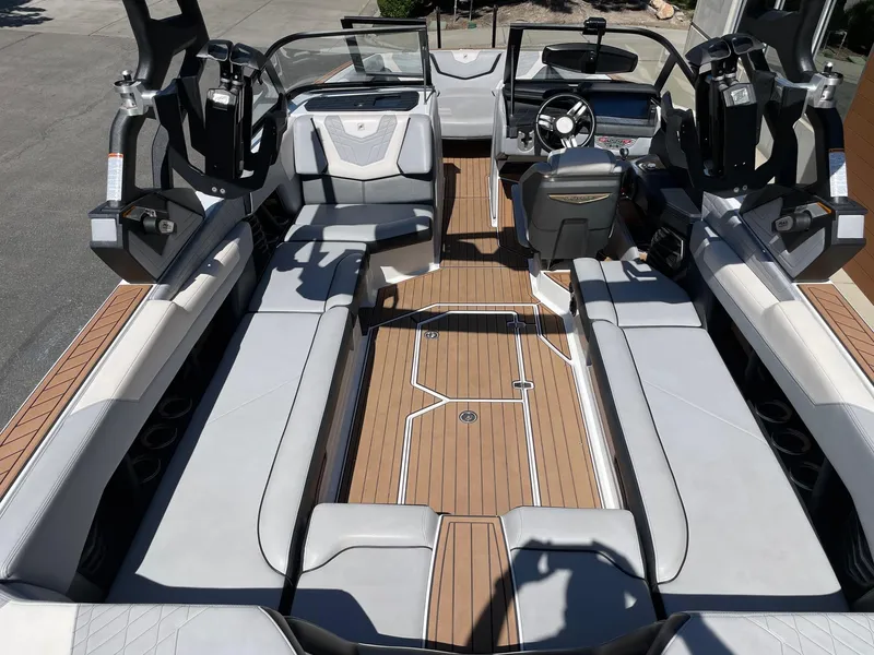 Slide: The Image of 2021 Nautique Super Air Nautique G25 interior with sleek seating and modern dashboard design. - 5