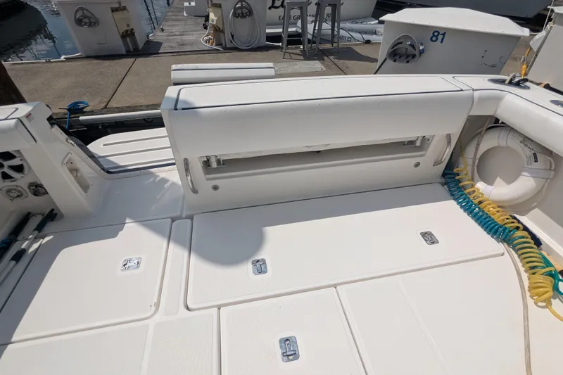 Slide: The Image of 2005 Tiara Yachts 3200 Open deck with seating and storage compartments. - 13