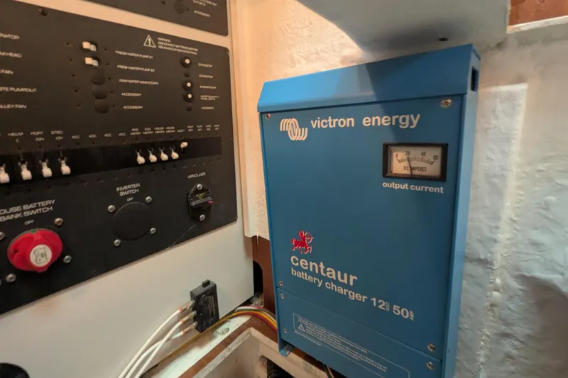 Slide: The Image of Electrical panel and Victron Energy Centaur battery charger on a 2005 Tiara Yachts 3200 Open. - 27