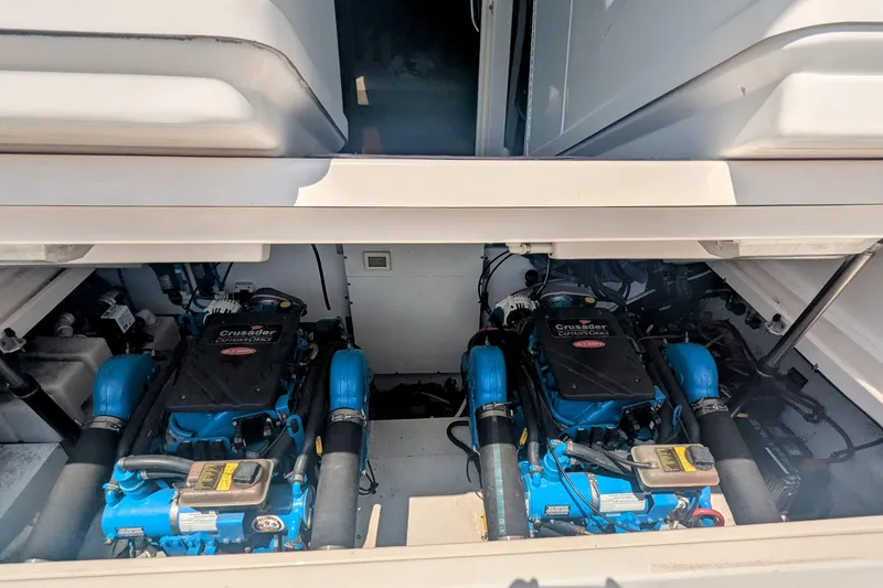 Slide: The Image of Engine compartment of a 2005 Tiara Yachts 3200 Open, featuring dual Crusader engines. - 31