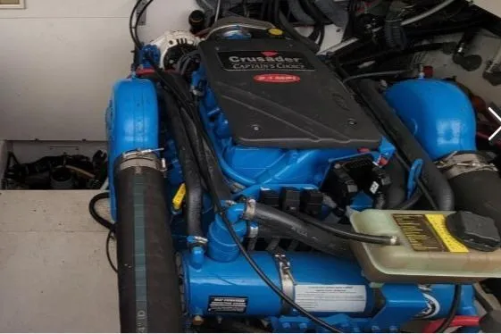 Slide: The Image of Engine compartment of a 2005 Tiara Yachts 3200 Open, featuring a Crusader engine. - 32