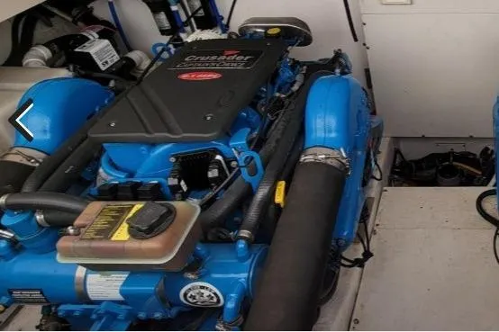 Slide: The Image of Engine compartment of a 2005 Tiara Yachts 3200 Open, featuring a Crusader engine. - 33