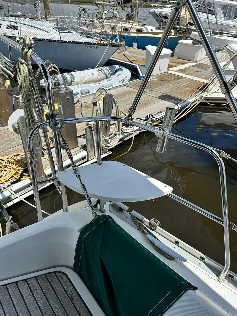Slide: The Image of Cockpit view of a 1998 Beneteau 381 sailboat docked at a marina. - 19