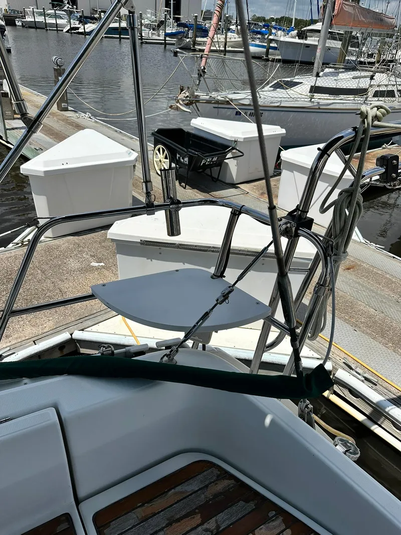 Slide: The Image of Sailboat docked at marina, Beneteau 381, 1998 model, with visible deck and equipment. - 20