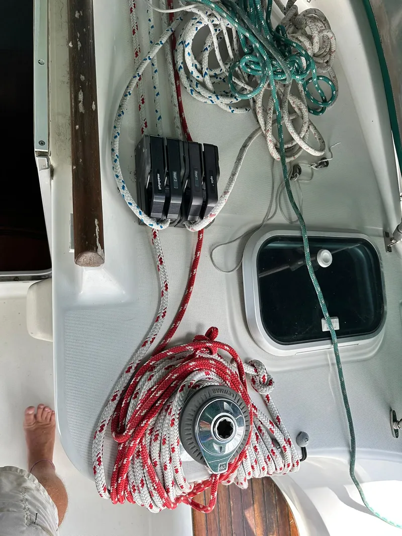 Slide: The Image of Deck of 1998 Beneteau 381 sailboat with ropes and winch. - 21