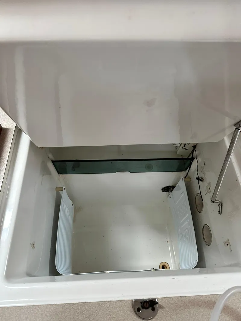 Slide: The Image of Open storage compartment inside a 1998 Beneteau 381 sailboat. - 29