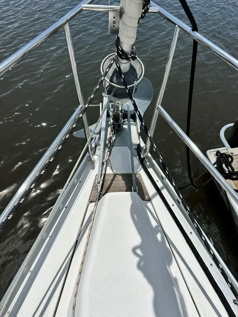 Slide: The Image of Bow of a 1998 Beneteau 381 sailboat with ropes and anchor. - 4