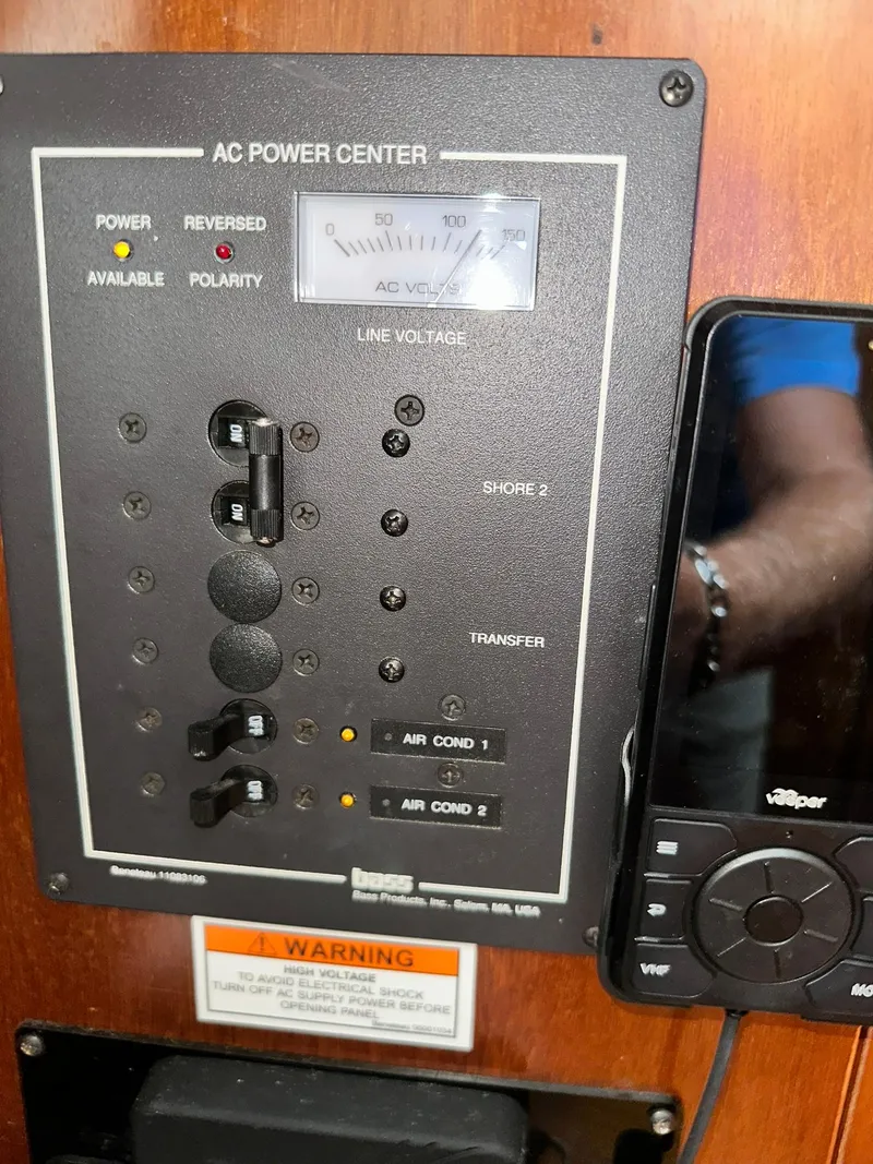 Slide: The Image of AC power center panel on a 1998 Beneteau 381 sailboat. - 42