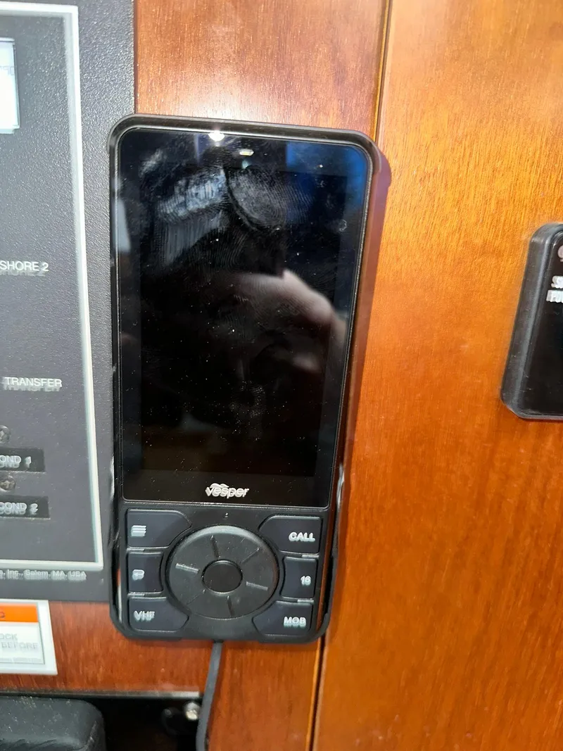 Slide: The Image of Vesper marine radio on a 1998 Beneteau 381 yacht control panel. - 43