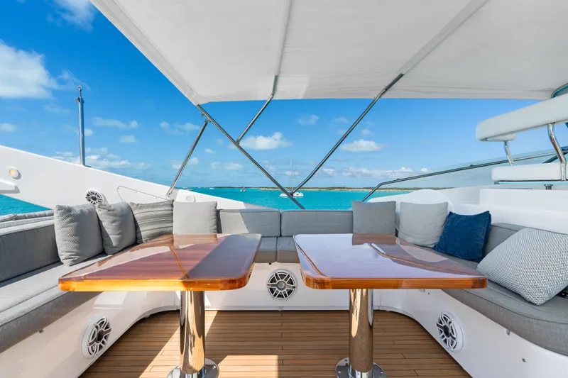 Slide: The Image of Luxurious deck seating on 2004 Ferretti Yachts 112 Custom Line, overlooking turquoise waters. - 13