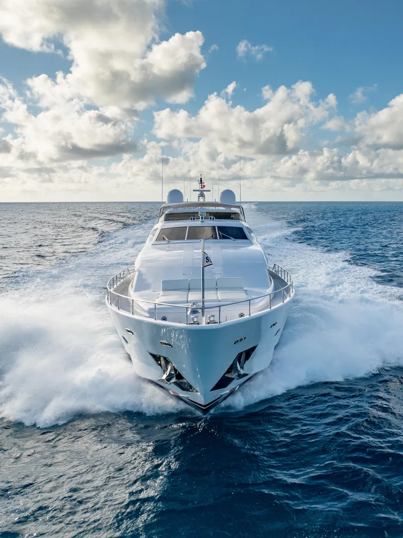 Slide: The Image of Luxurious 2004 Ferretti Yachts 112 Custom Line cruising on open sea under blue sky. - 16