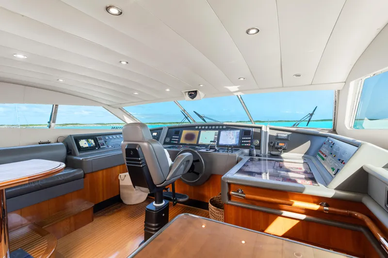 Slide: The Image of Luxurious helm of 2004 Ferretti Yachts 112 Custom Line, featuring advanced navigation systems. - 26