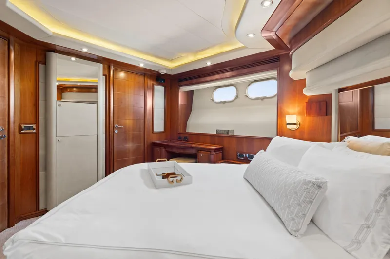 Slide: The Image of Luxurious bedroom interior of 2004 Ferretti Yachts 112 Custom Line with elegant wood finishes. - 42