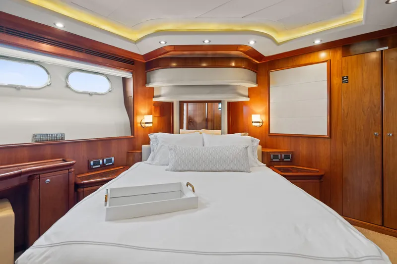 Slide: The Image of Luxurious bedroom interior of 2004 Ferretti Yachts 112 Custom Line, featuring elegant wood paneling. - 43