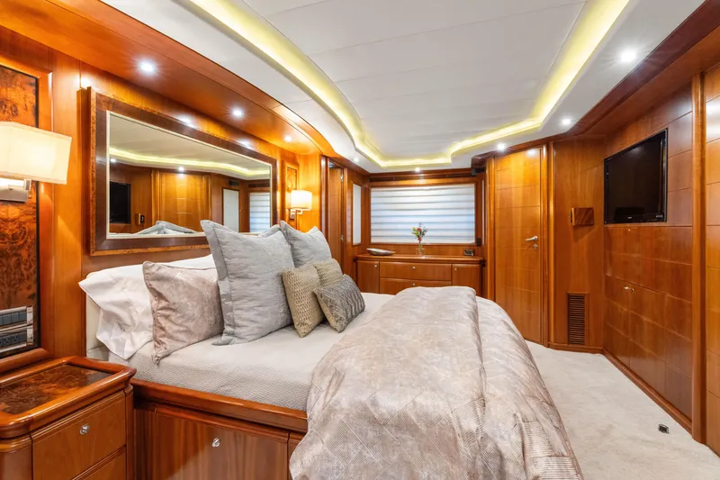 Slide: The Image of Luxurious bedroom interior of 2004 Ferretti Yachts 112 Custom Line, featuring elegant wood paneling. - 46