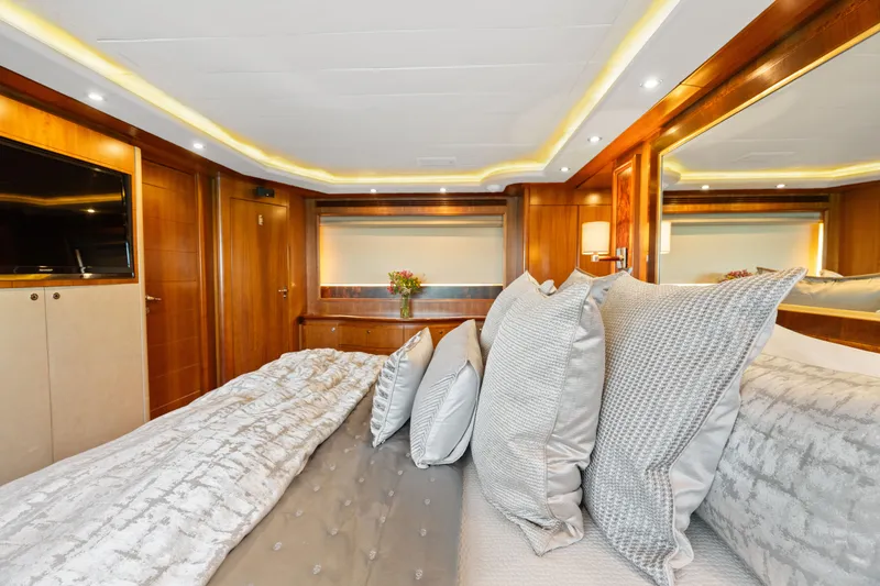 Slide: The Image of Luxurious bedroom interior on 2004 Ferretti Yachts 112 Custom Line, featuring elegant wood paneling. - 50