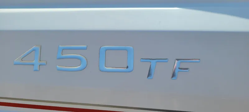 Slide: The Image of 2016 Tahoe 450 TF emblem on a white surface. - 17