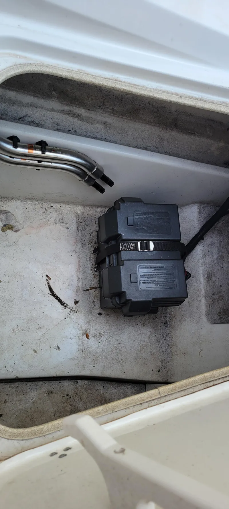 Slide: The Image of Battery compartment of 2016 Tahoe 450 TF boat, featuring secured battery and wiring. - 22