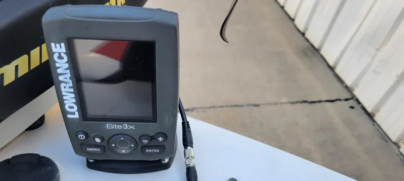 Slide: The Image of Lowrance Elite 3X fish finder on a 2016 Tahoe 450 TF boat. - 24