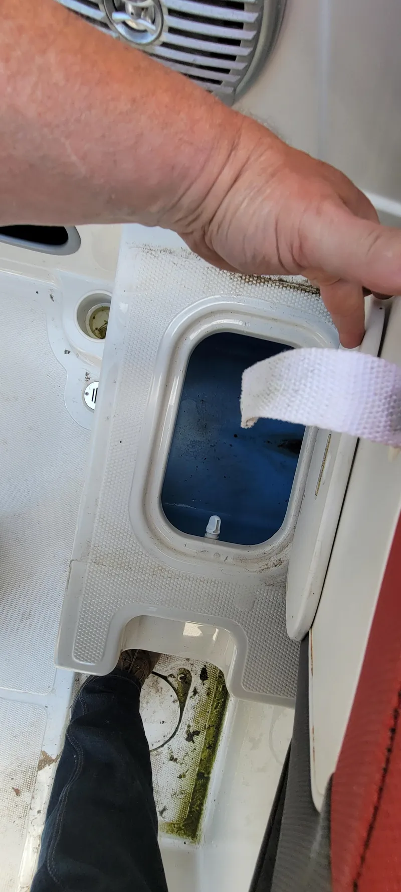 Slide: The Image of Person opening storage compartment on 2016 Tahoe 450 TF boat deck. - 32