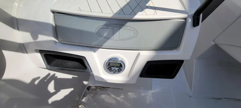 Slide: The Image of Control panel of a 2016 Tahoe 450 TF boat with stereo system. - 33