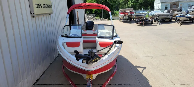 Slide: The Image of 2016 Tahoe 450 TF boat with red accents at Ted's Boatarama. - 4