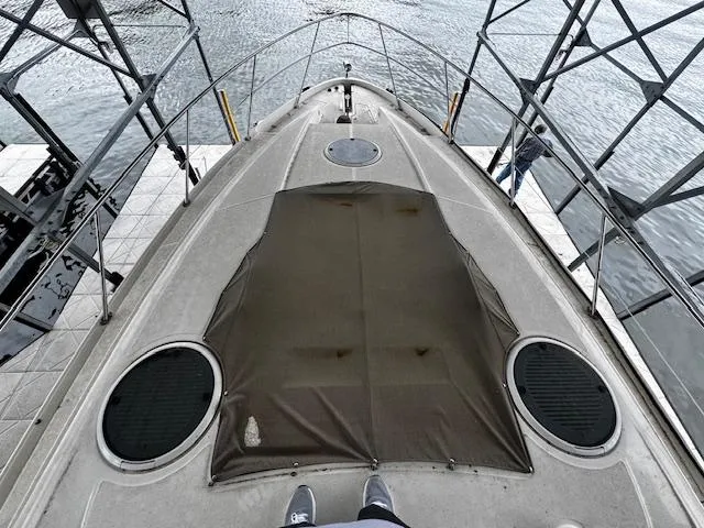 Slide: The Image of 2004 Regal Commodore 4260 boat docked, top view of bow and deck area. - 11