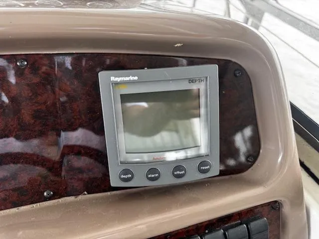 Slide: The Image of Raymarine depth gauge on 2004 Regal Commodore 4260 dashboard. - 20