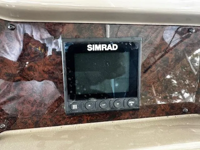 Slide: The Image of Simrad display on 2004 Regal Commodore 4260 boat dashboard. - 21