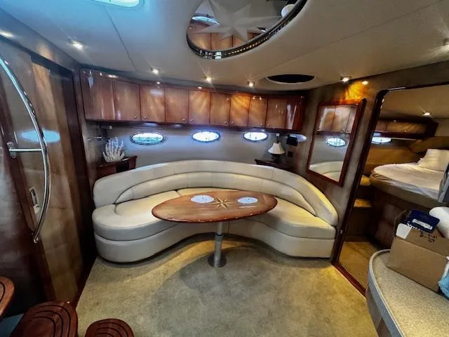 Slide: The Image of Luxurious interior of 2004 Regal Commodore 4260 yacht with elegant seating and wood finishes. - 36
