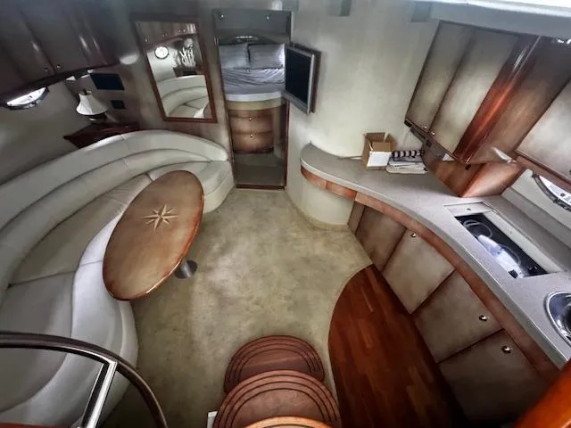 Slide: The Image of Luxurious interior of 2004 Regal Commodore 4260 yacht with elegant seating and modern amenities. - 45