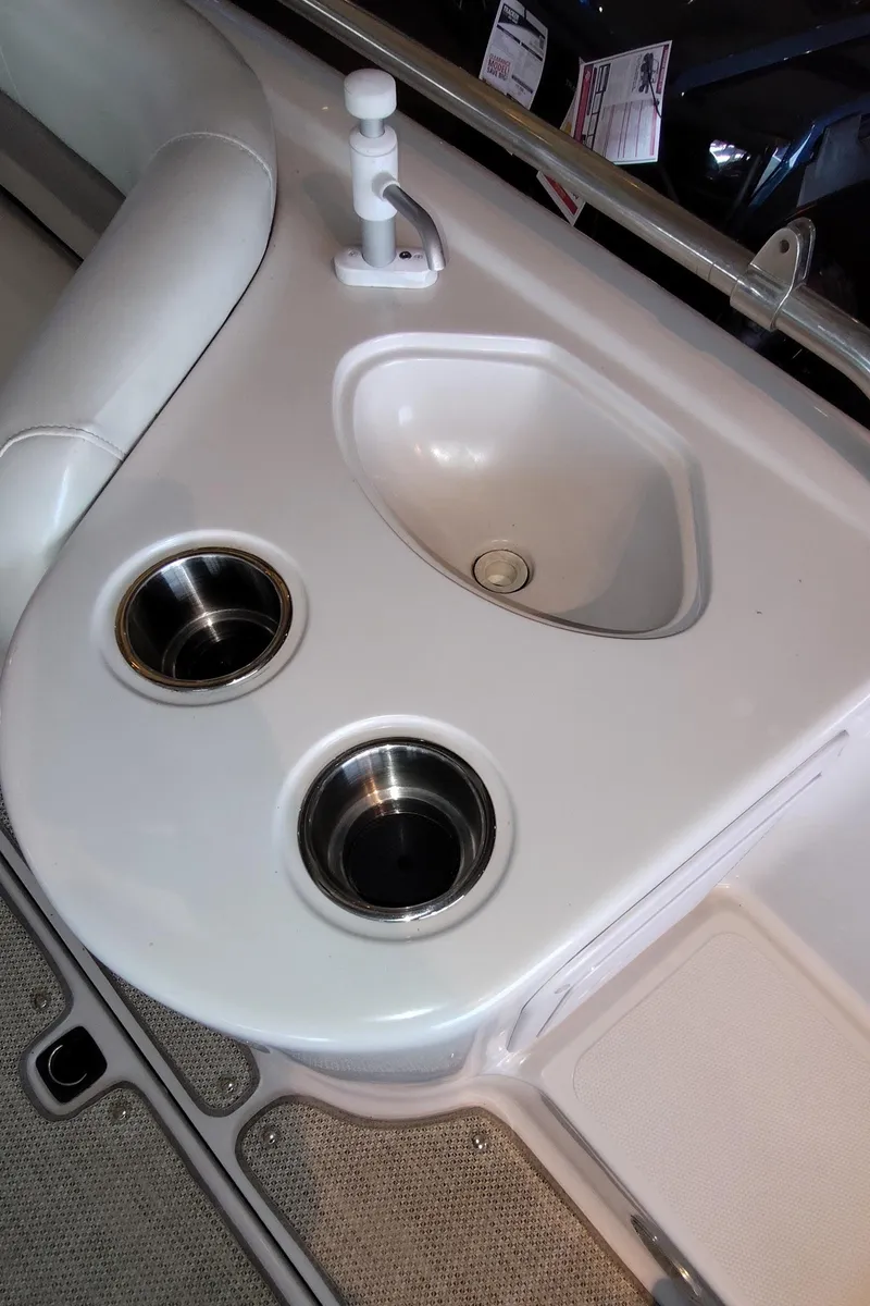 Slide: The Image of Boat sink and cup holders on a 2001 Hurricane 201GS. - 11