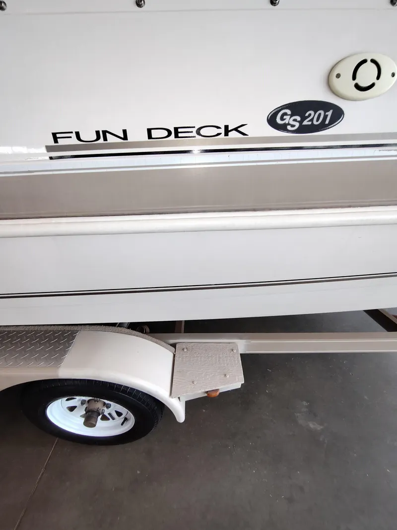 Slide: The Image of 2001 Hurricane 201GS Fun Deck boat on trailer, partial side view. - 18