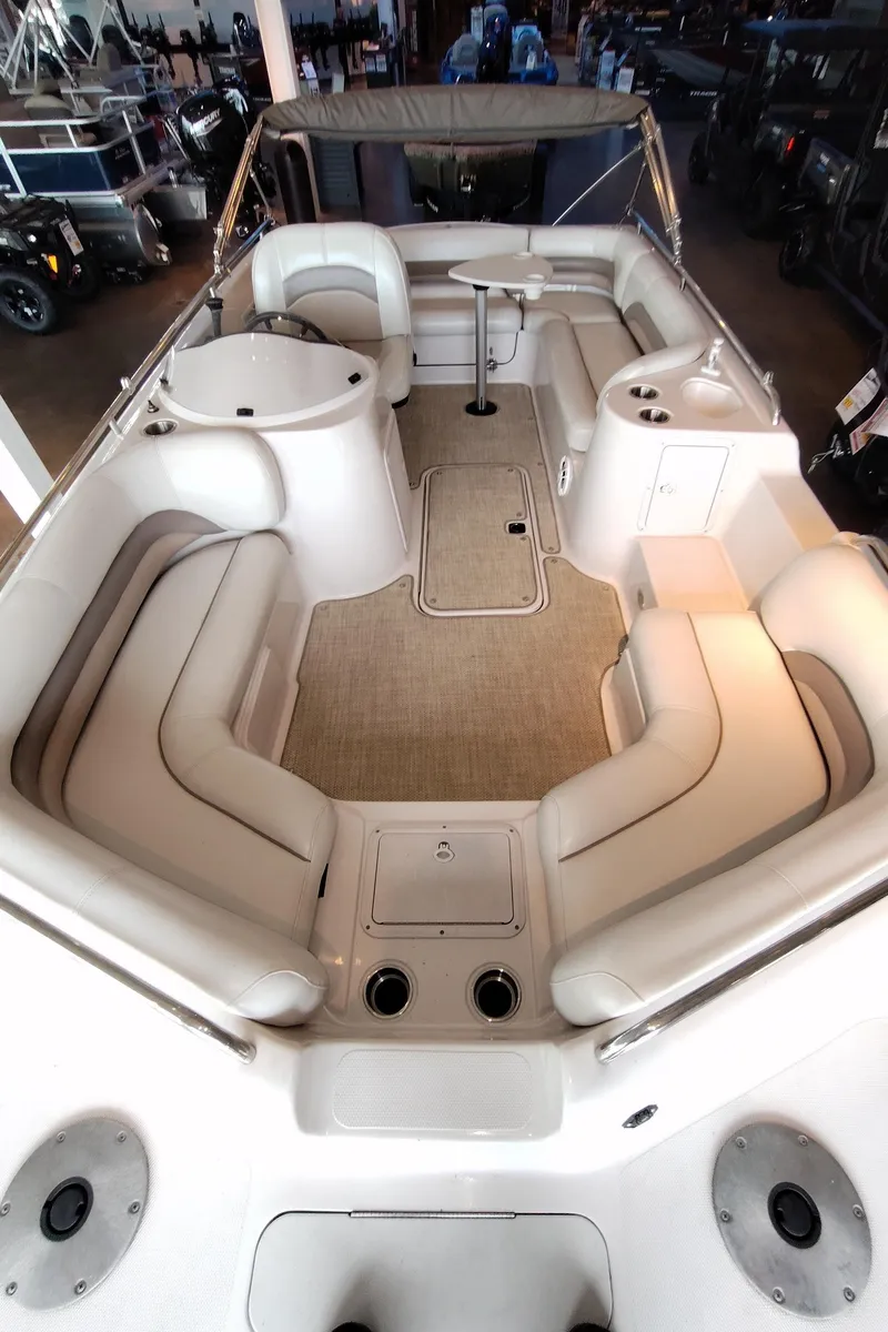 Slide: The Image of 2001 Hurricane 201GS boat interior with spacious seating and beige upholstery. - 5