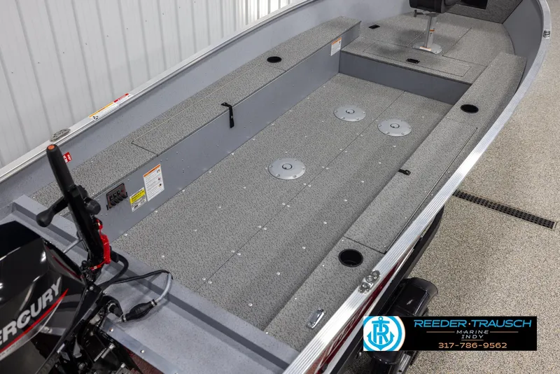 Slide: The Image of 2025 Lund 1600 Fury Heritage Edition boat interior with Mercury engine, showcased by Reeder-Trausch Marine. - 10