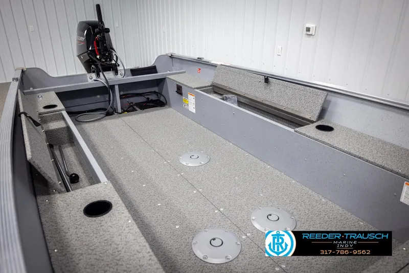 Slide: The Image of 2025 Lund 1600 Fury Heritage Edition boat interior with Mercury engine, showcased by Reeder-Trausch Marine. - 17