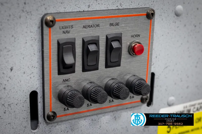 Slide: The Image of Control panel of 2025 Lund 1600 Fury Heritage Edition boat with switches and knobs. - 18