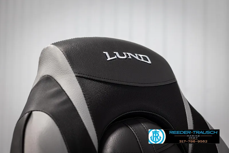 Slide: The Image of 2025 Lund 1600 Fury Heritage Edition boat seat, black and gray design, close-up view. - 19